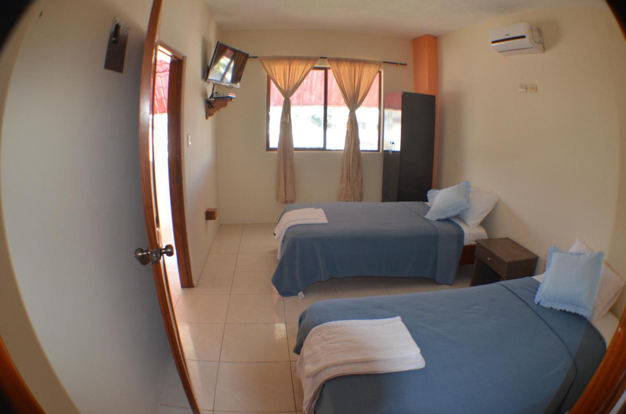 Hostal Tongo Reef Puerto Baquerizo Moreno Rum bild